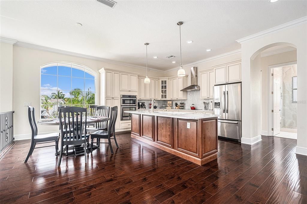 Dining room, Interior, Kitchen, Pendant Lights, Recessed Lighting, Stainless Steel Appliances, Wood Texture Flooring