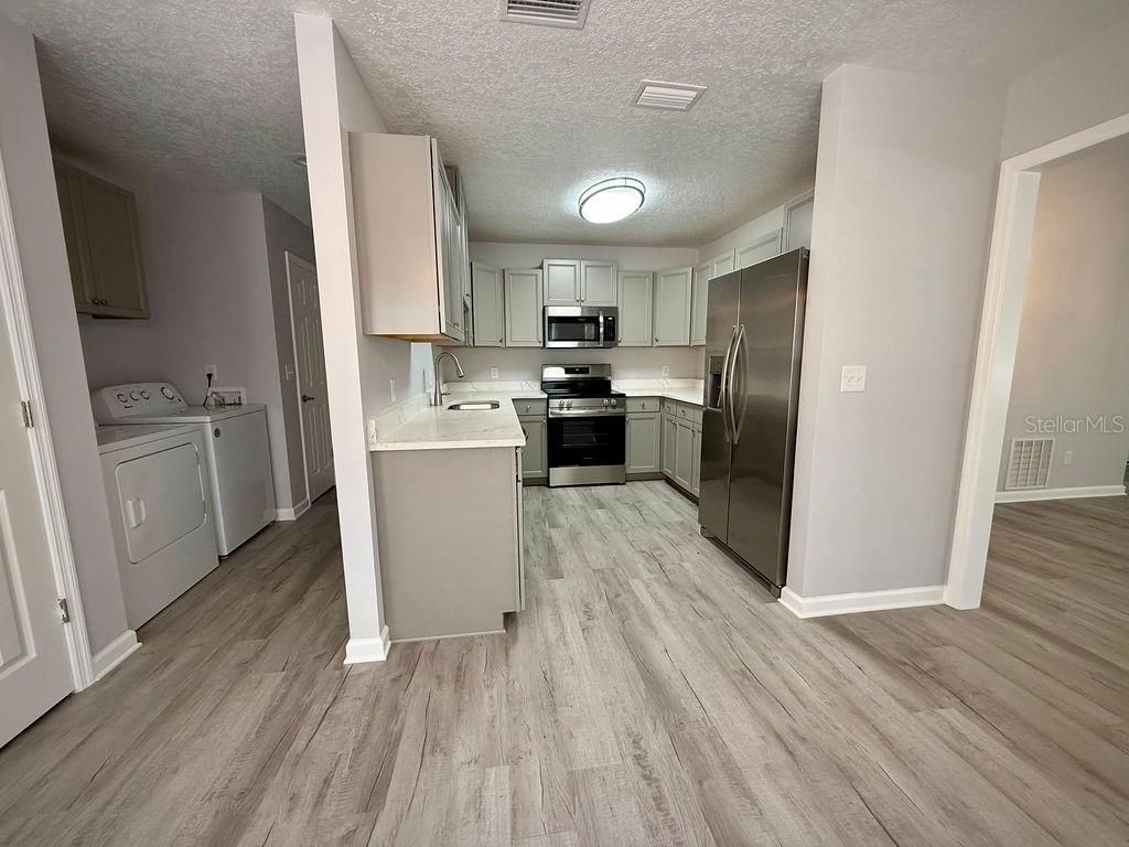 Interior, Kitchen, Stainless Steel Appliances, Washer, Wood Texture Flooring