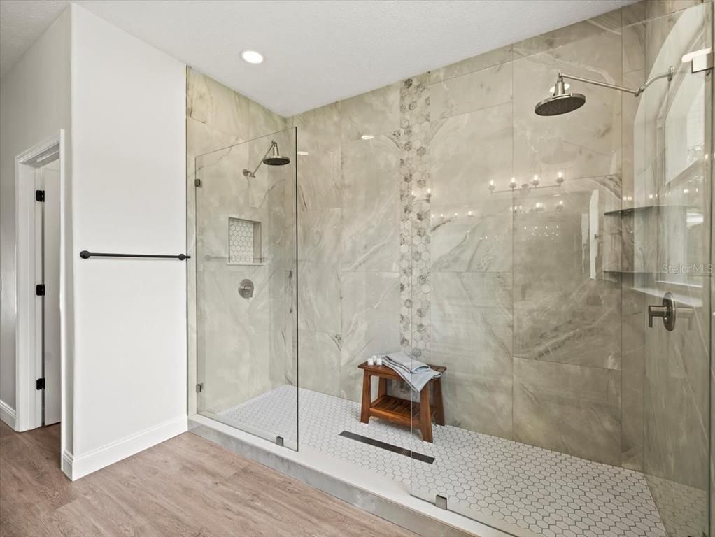 Bathroom, Glass Shower, Interior, Marble Walls, Recessed Lighting, Wood Texture Flooring