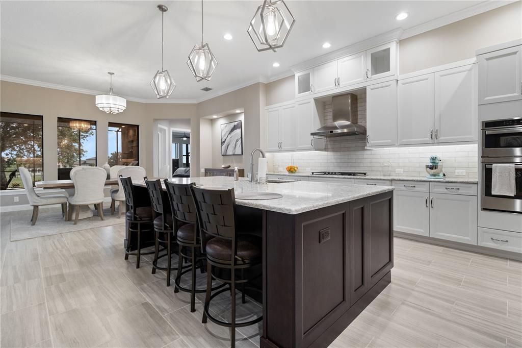 Chandelier, Dining room, Interior, Kitchen, Pendant Lights, Recessed Lighting, Stainless Steel Appliances, Wood Texture Flooring