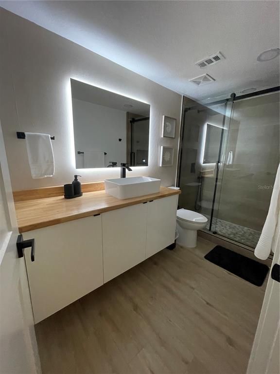 Bathroom, Dual Sink Vanities, Glass Shower, Interior, Wood Texture Flooring