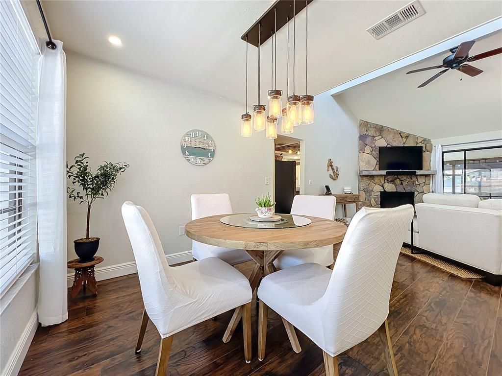 Dining room, Fireplace, Interior, Living room, Pendant Lights, Recessed Lighting, Stone Walls, Wood Texture Flooring