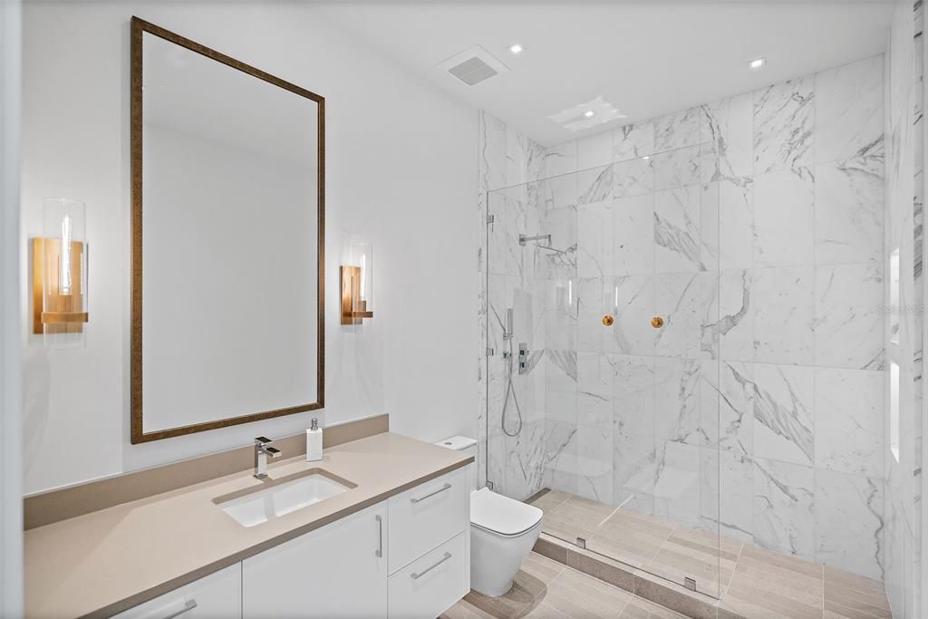 Bathroom, Glass Shower, Interior, Marble Walls, Recessed Lighting, Wood Texture Flooring