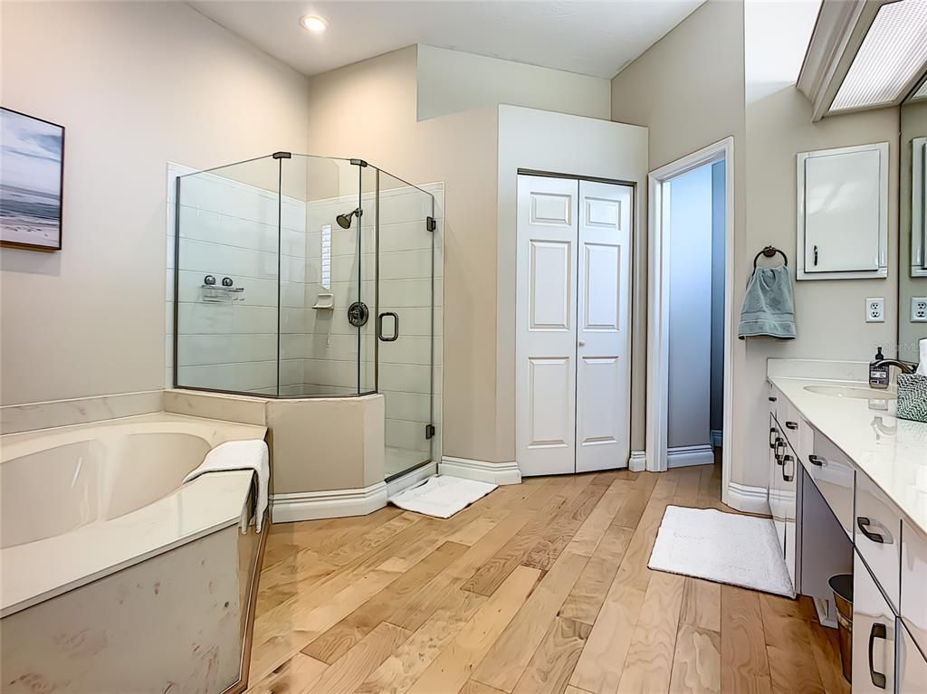Bathroom, Dual Sink Vanities, Glass Shower, Interior, Recessed Lighting, Wood Texture Flooring