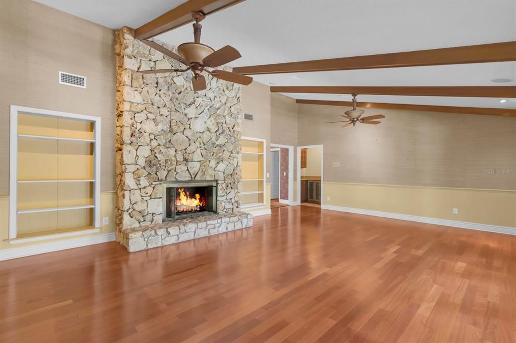Empty room, Fireplace, Interior, Recessed Lighting, Stone Walls, Wooden Beams, Wood Texture Flooring