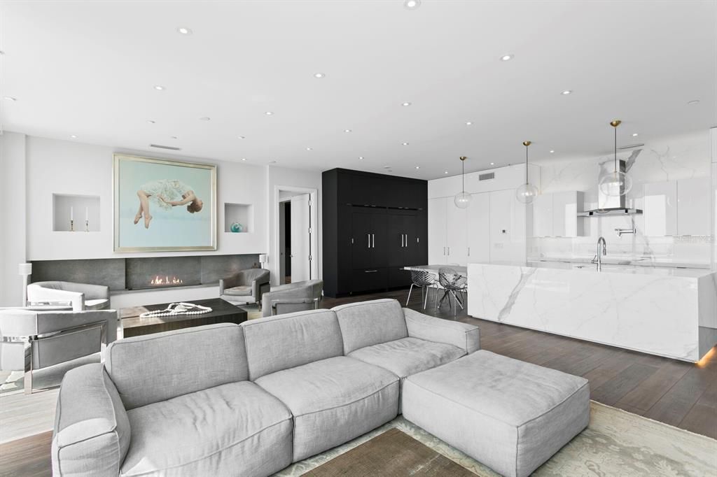 Fireplace, Interior, Kitchen, Living room, Marble Walls, Pendant Lights, Recessed Lighting, Wood Texture Flooring