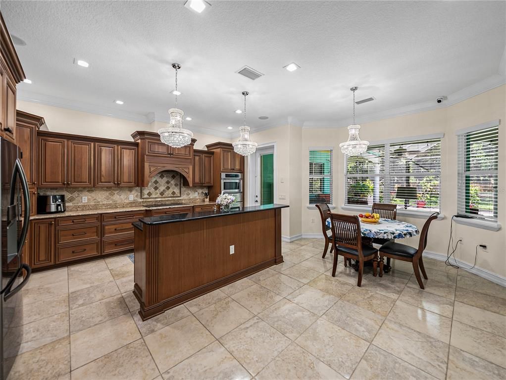 Chandelier, Dining room, Interior, Kitchen, Pendant Lights, Recessed Lighting, Stainless Steel Appliances