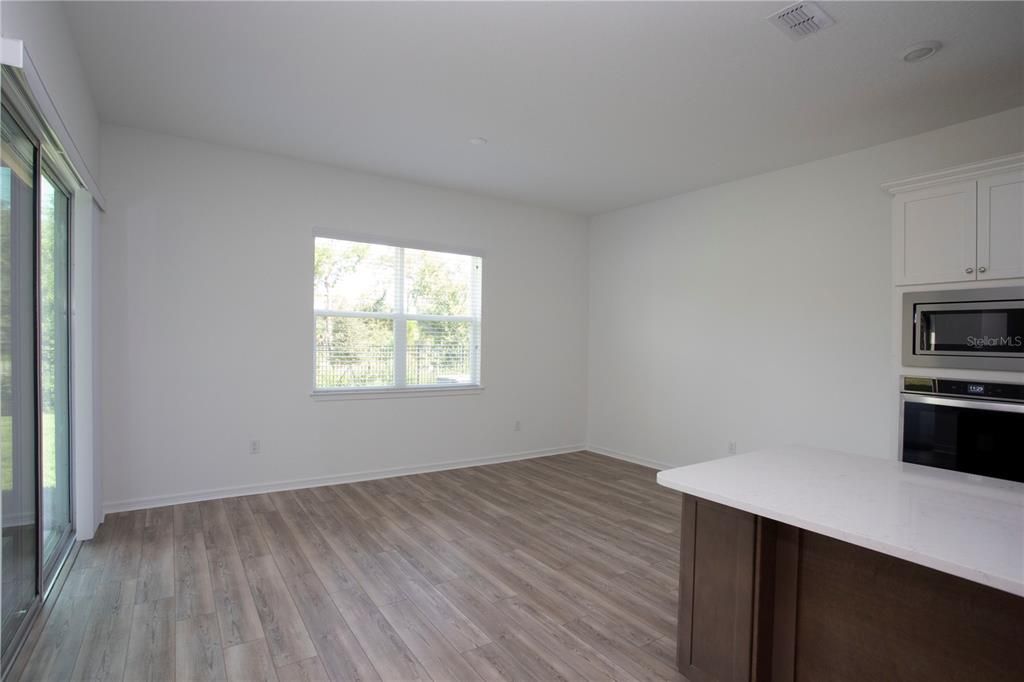 Empty room, Interior, Kitchen, Stainless Steel Appliances, Wood Texture Flooring
