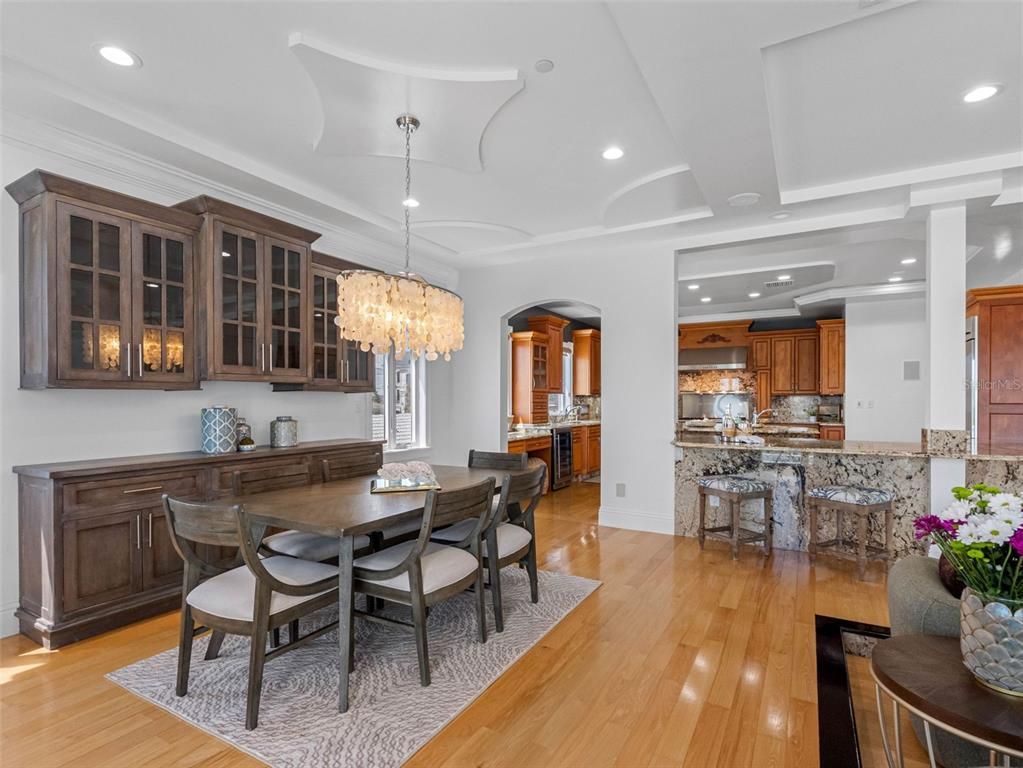 Chandelier, Dining room, Interior, Kitchen, Recessed Lighting, Stainless Steel Appliances, Wood Texture Flooring
