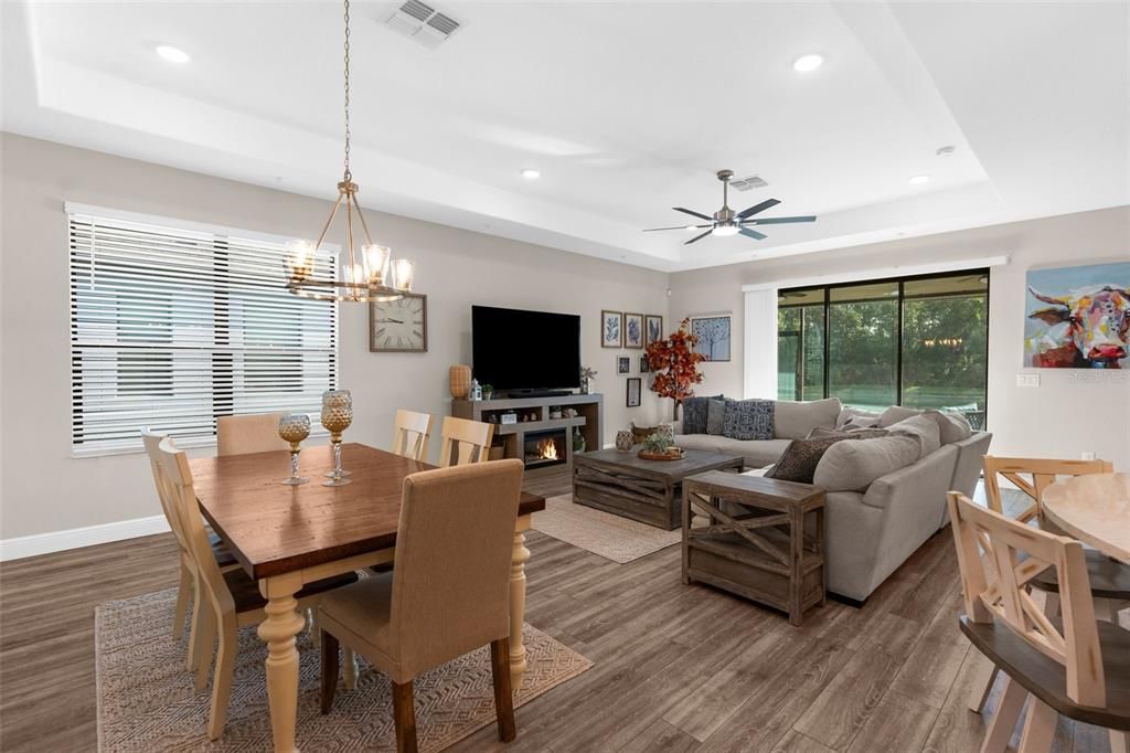 Dining room, Fireplace, Interior, Living room, Pendant Lights, Recessed Lighting, Wood Texture Flooring