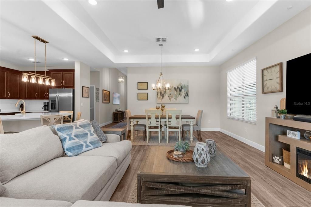 Chandelier, Dining room, Fireplace, Interior, Kitchen, Living room, Pendant Lights, Recessed Lighting, Stainless Steel Appliances, Wood Texture Flooring