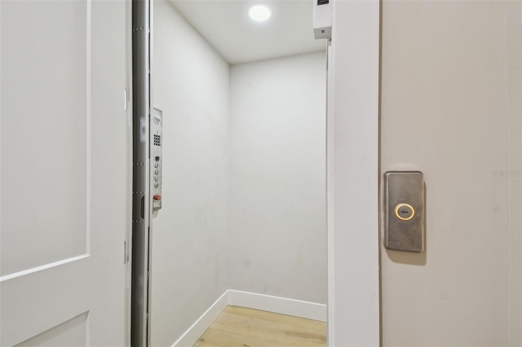 Elevator, Interior, Recessed Lighting, Wood Texture Flooring