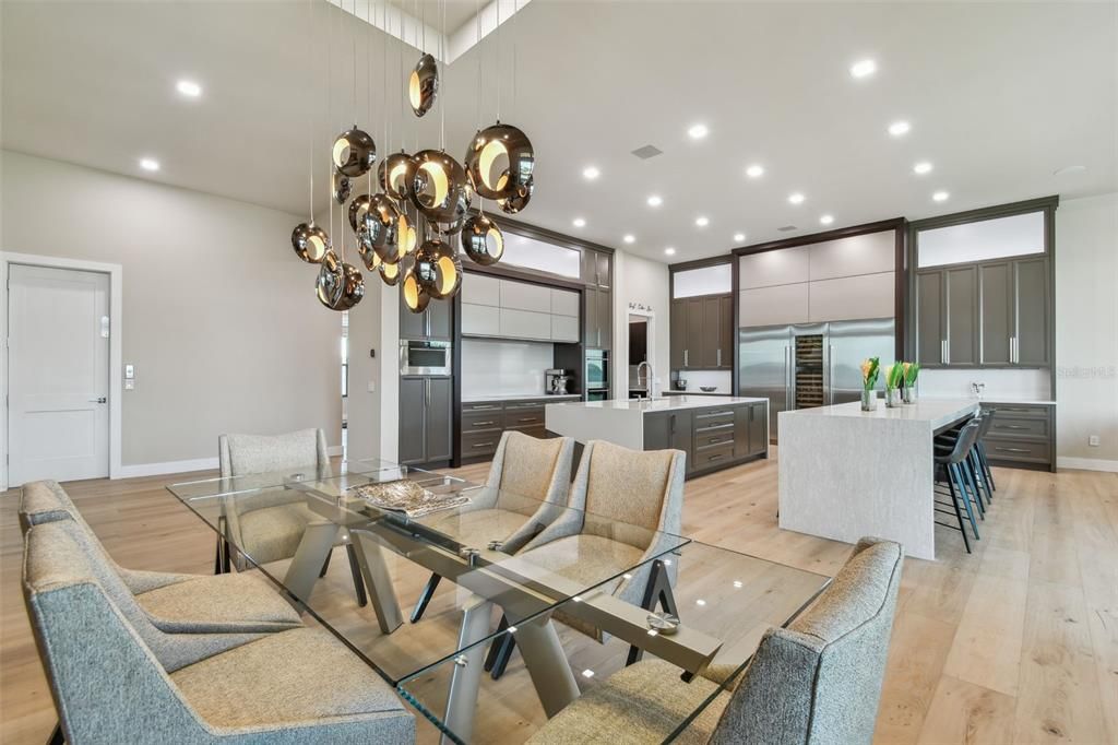 Dining room, Interior, Kitchen, Pendant Lights, Recessed Lighting, Stainless Steel Appliances, Wood Texture Flooring