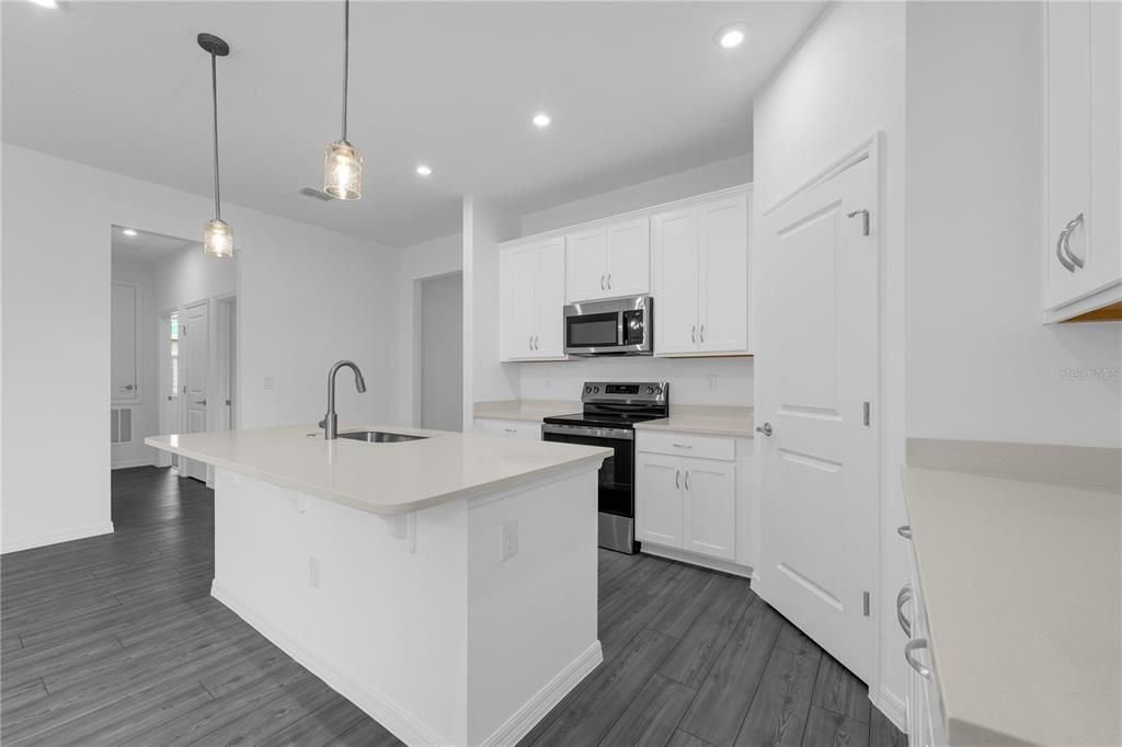 Interior, Kitchen, Pendant Lights, Recessed Lighting, Stainless Steel Appliances, Wood Texture Flooring