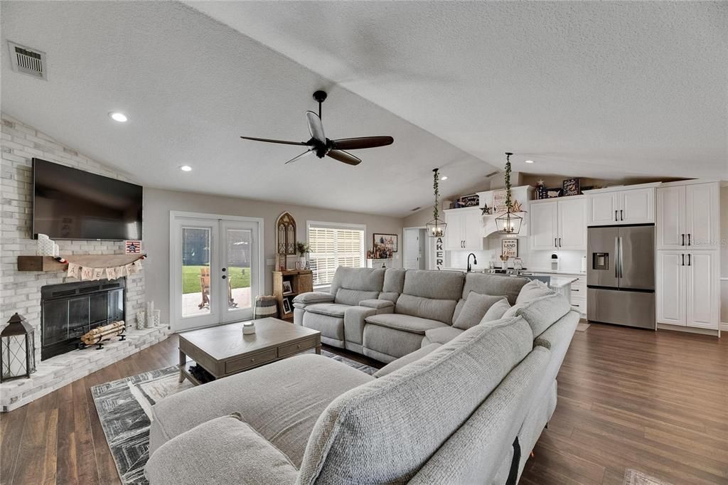 Fireplace, Interior, Kitchen, Living room, Pendant Lights, Recessed Lighting, Stone Walls, Wood Texture Flooring