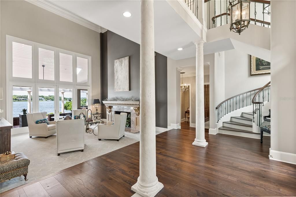 Chandelier, Fireplace, Interior, Living room, Recessed Lighting, Water, Wood Texture Flooring