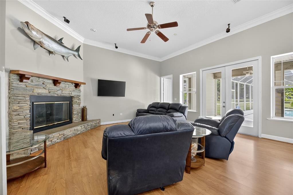 Fireplace, Interior, Living room, Recessed Lighting, Stone Walls, Wood Texture Flooring