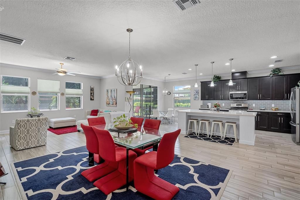 Chandelier, Dining room, Interior, Kitchen, Pendant Lights, Recessed Lighting, Stainless Steel Appliances, Wood Texture Flooring