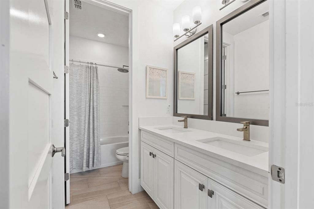 Bathroom, Dual Sink Vanities, Interior, Recessed Lighting, Wood Texture Flooring