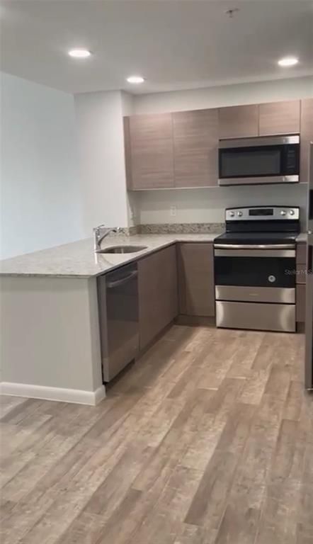 Interior, Kitchen, Recessed Lighting, Stainless Steel Appliances, Wood Texture Flooring