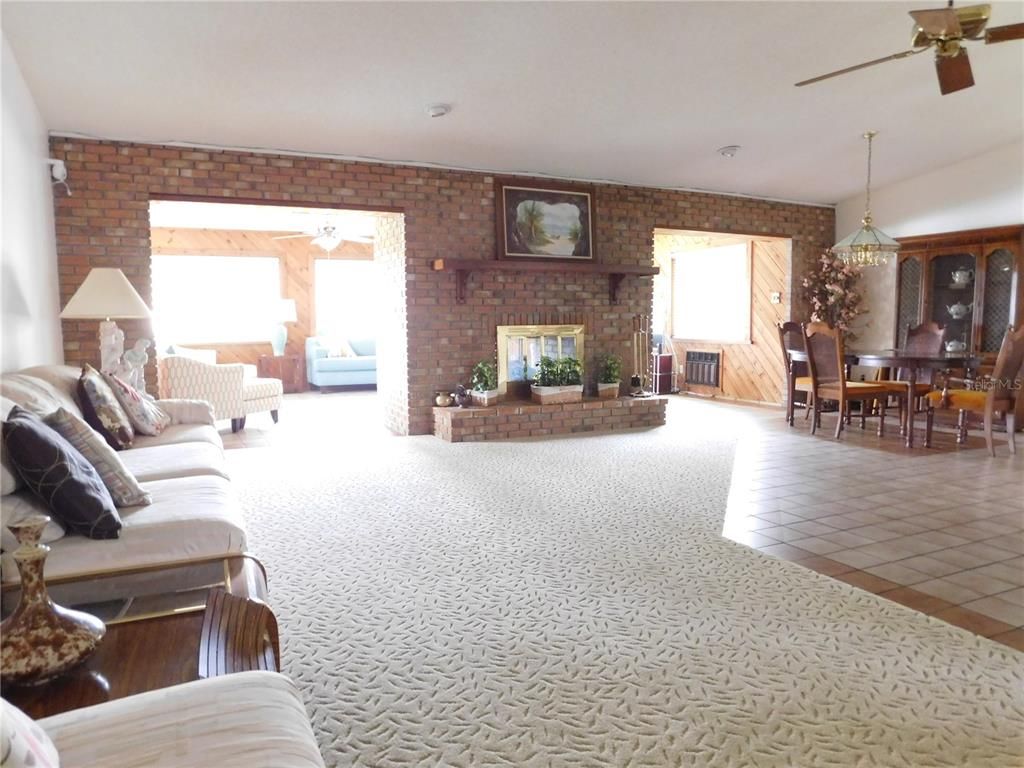 Chandelier, Dining room, Fireplace, Interior, Living room, Stone Walls