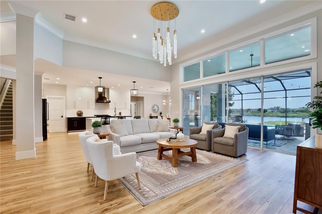 Dining room, Interior, Kitchen, Living room, Pendant Lights, Recessed Lighting, Stainless Steel Appliances, Water, Wood Texture Flooring