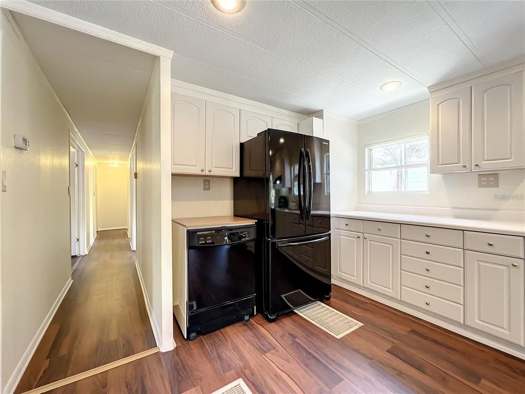 Interior, Kitchen, Recessed Lighting, Washer, Wood Texture Flooring