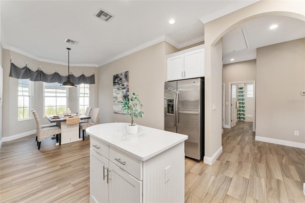 Dining room, Interior, Kitchen, Pendant Lights, Recessed Lighting, Stainless Steel Appliances, Wood Texture Flooring