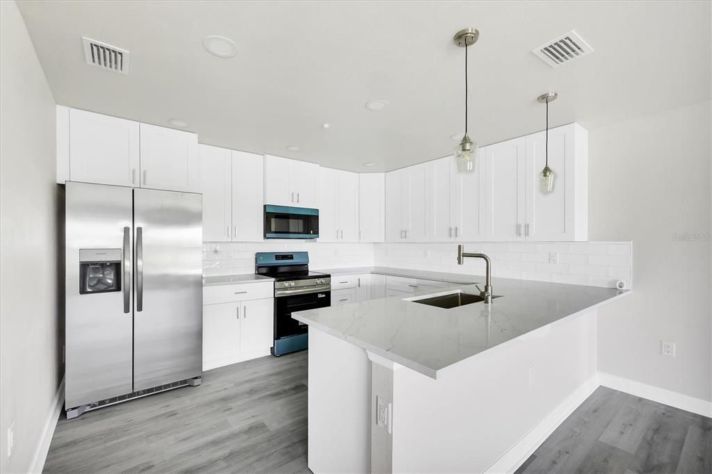 Interior, Kitchen, Pendant Lights, Recessed Lighting, Stainless Steel Appliances, Wood Texture Flooring
