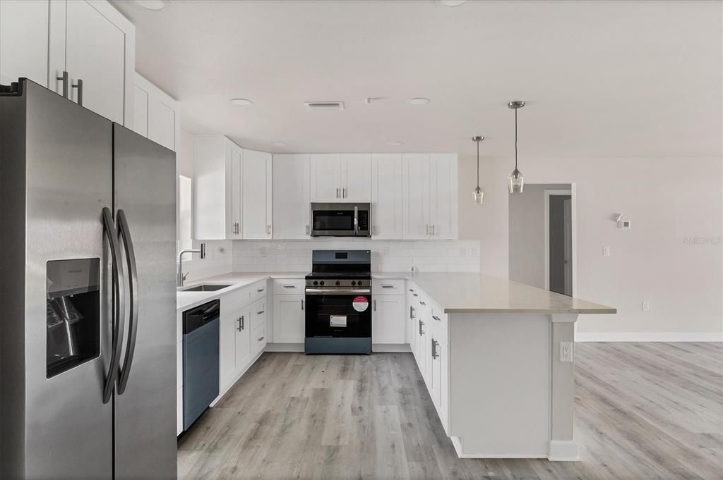 Interior, Kitchen, Pendant Lights, Recessed Lighting, Stainless Steel Appliances, Wood Texture Flooring