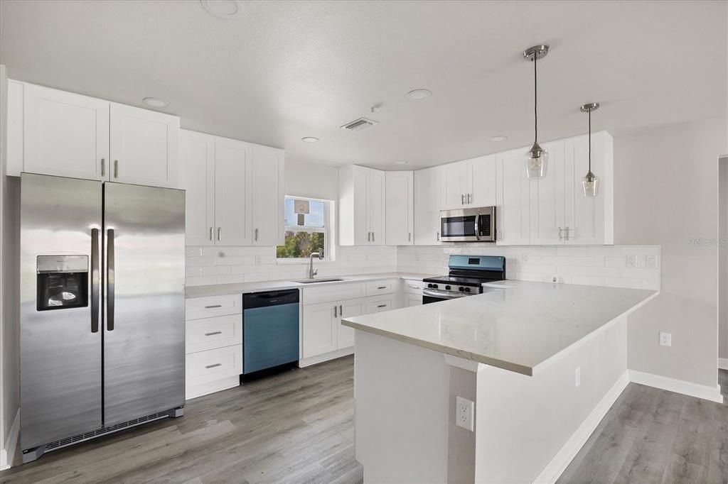 Interior, Kitchen, Pendant Lights, Recessed Lighting, Stainless Steel Appliances, Wood Texture Flooring