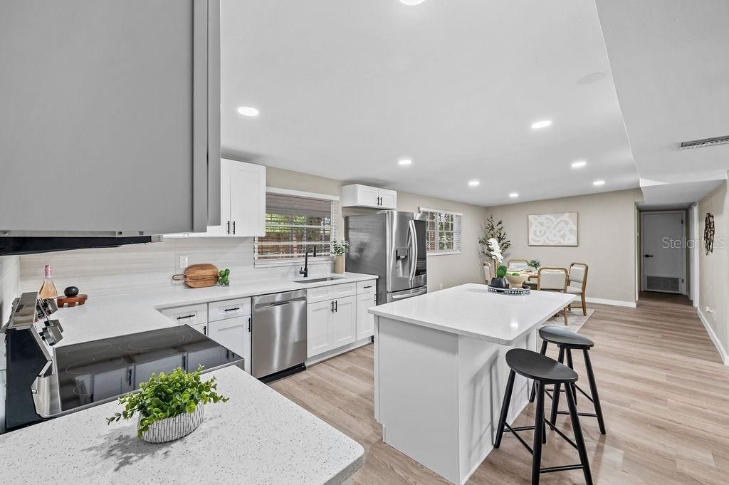 Dining room, Interior, Kitchen, Recessed Lighting, Stainless Steel Appliances, Wood Texture Flooring