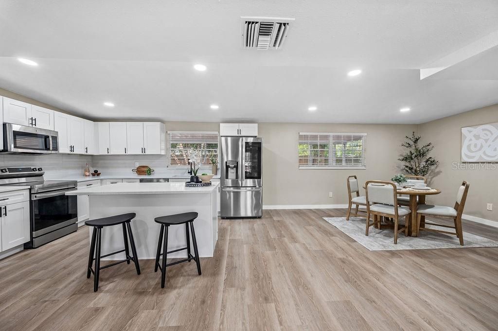 Dining room, Interior, Kitchen, Recessed Lighting, Stainless Steel Appliances, Wood Texture Flooring