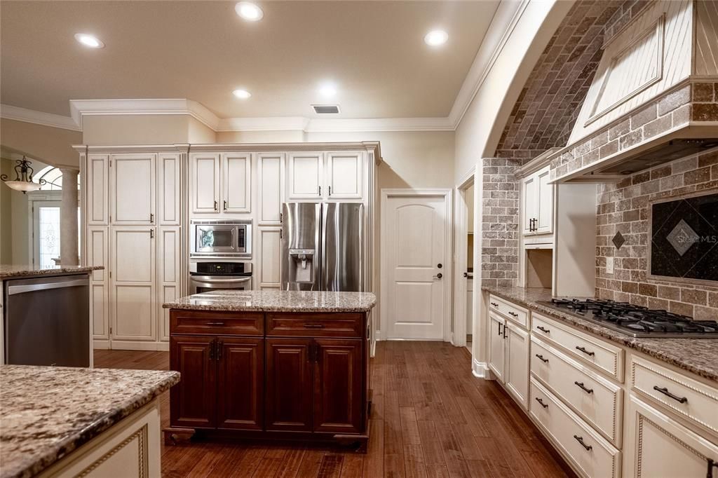Interior, Kitchen, Recessed Lighting, Stainless Steel Appliances, Stone Walls, Wood Texture Flooring