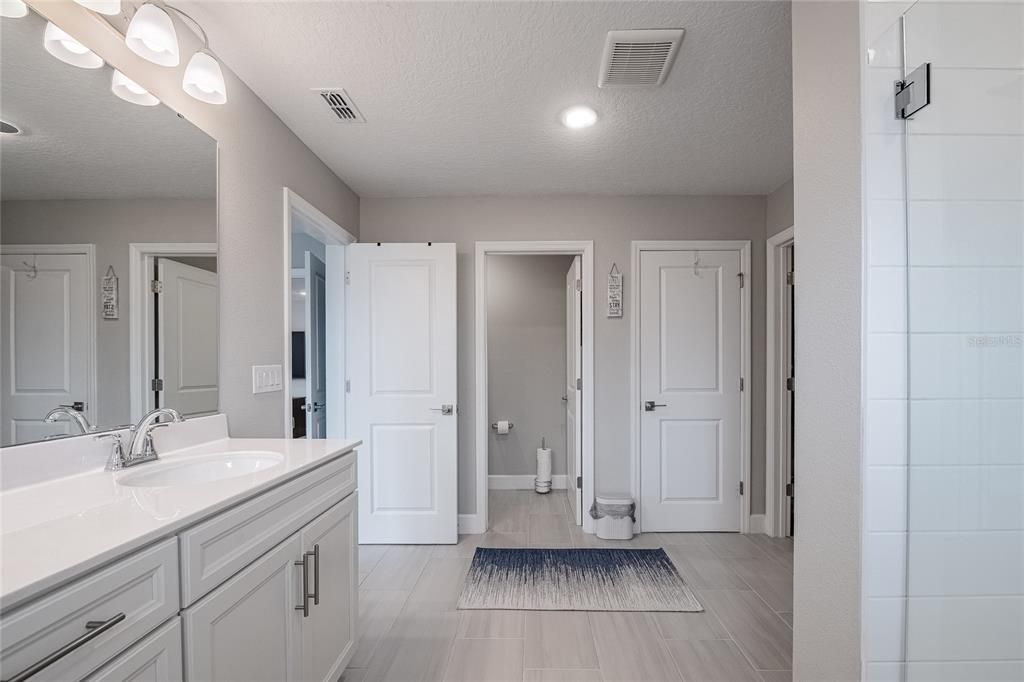 Bathroom, Dual Sink Vanities, Interior, Recessed Lighting, Wood Texture Flooring