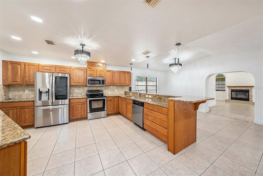 Fireplace, Interior, Kitchen, Pendant Lights, Recessed Lighting, Stainless Steel Appliances