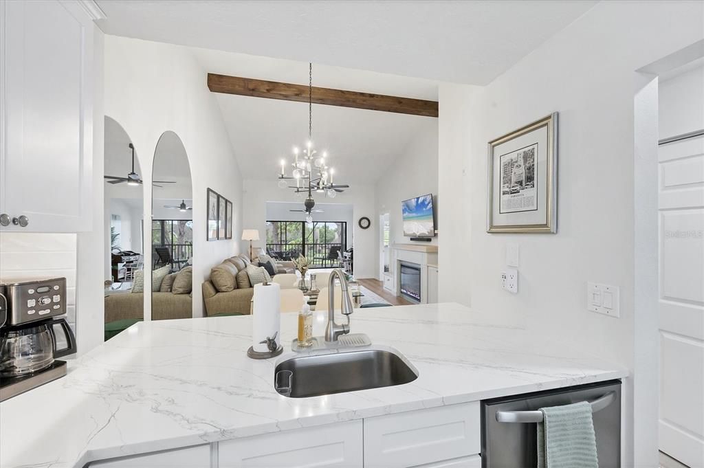 Chandelier, Dining room, Fireplace, Interior, Kitchen, Living room, Pendant Lights, Wooden Beams