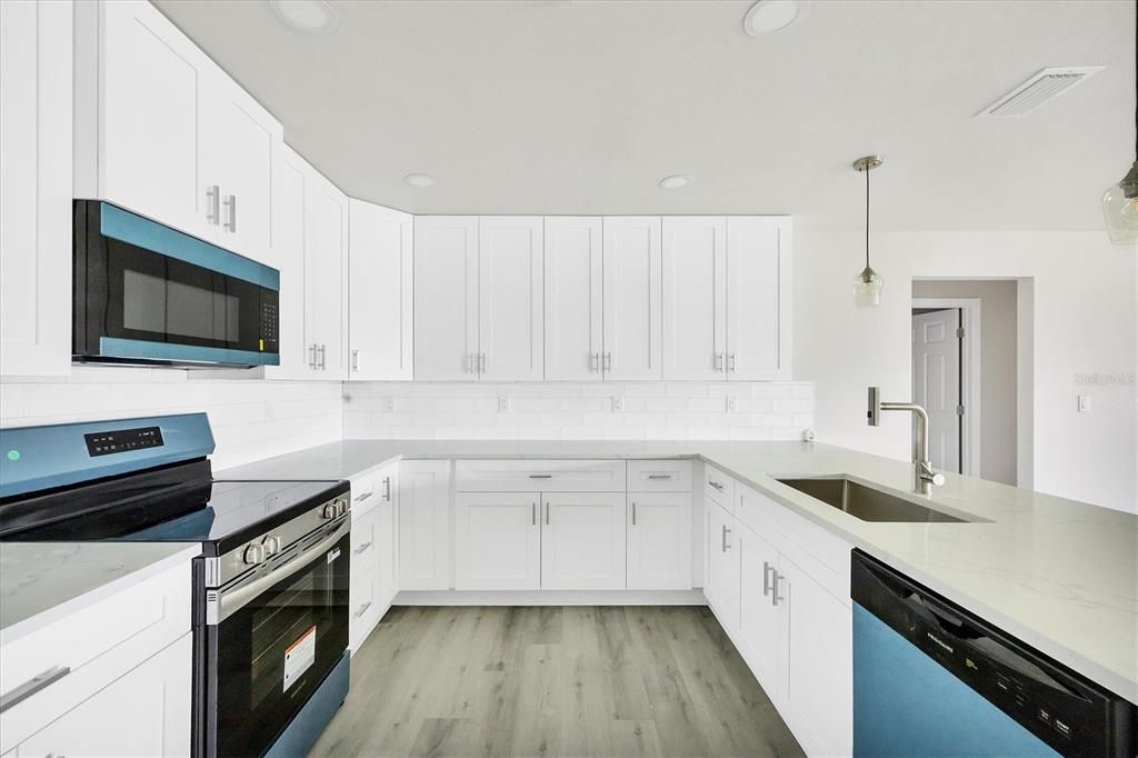 Interior, Kitchen, Pendant Lights, Recessed Lighting, Stainless Steel Appliances, Wood Texture Flooring
