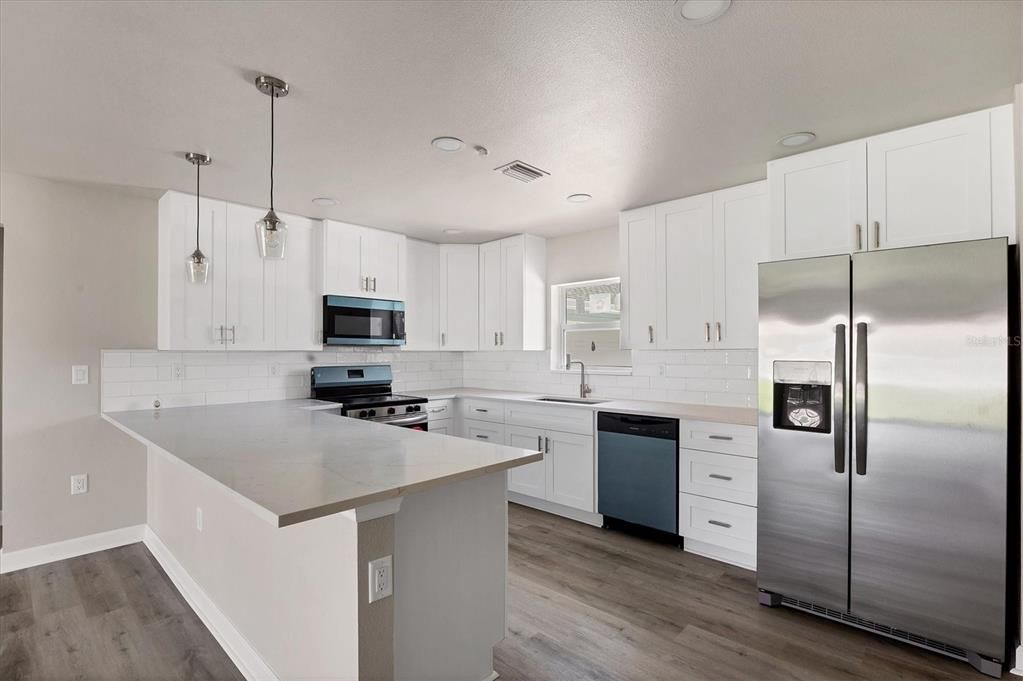 Interior, Kitchen, Pendant Lights, Recessed Lighting, Stainless Steel Appliances, Wood Texture Flooring