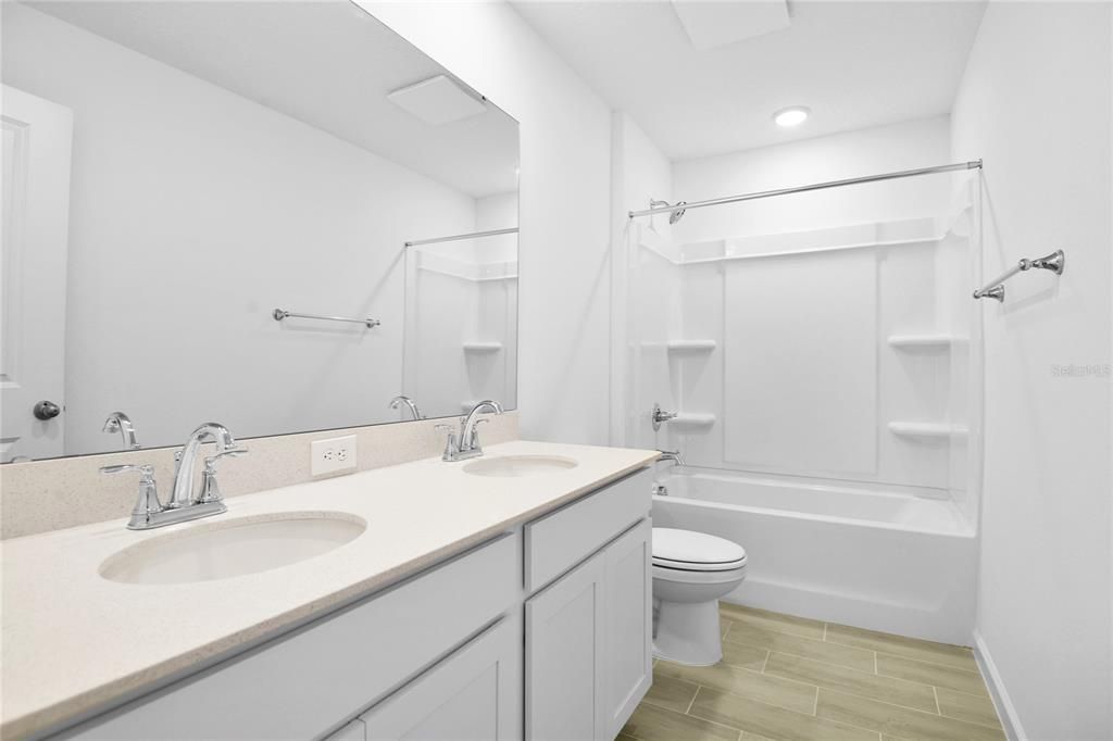 Bathroom, Dual Sink Vanities, Interior, Recessed Lighting, Walk-in Closets, Wood Texture Flooring