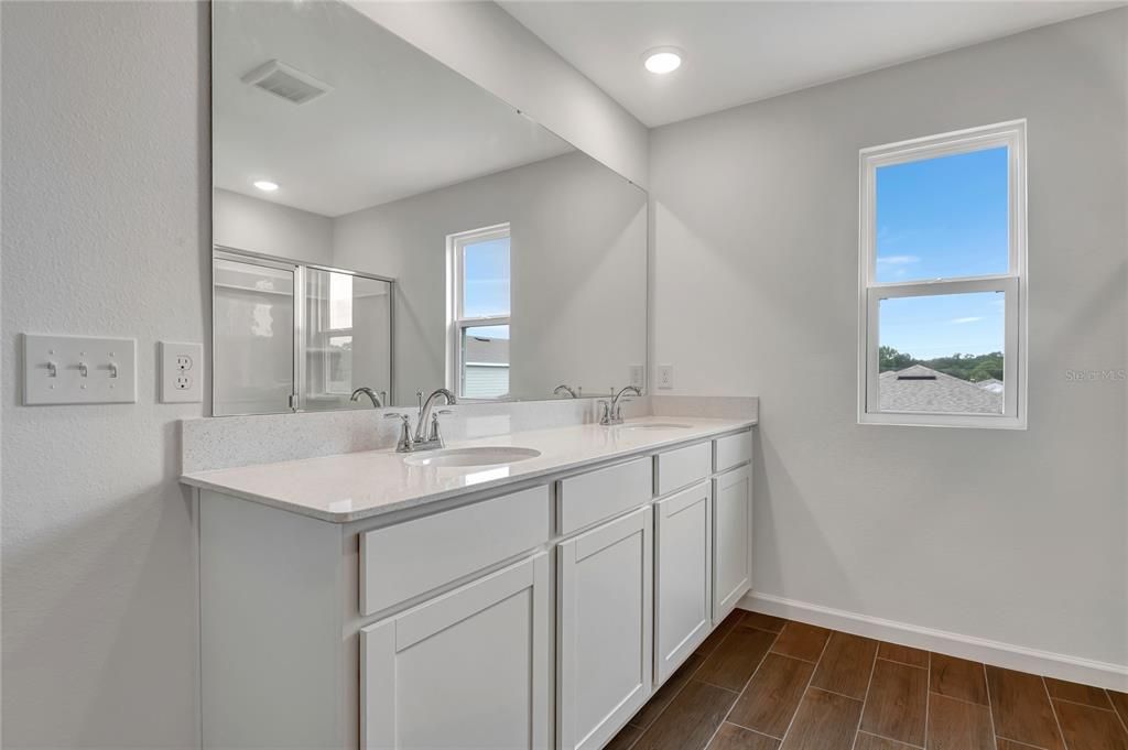 Bathroom, Dual Sink Vanities, Interior, Recessed Lighting, Wood Texture Flooring