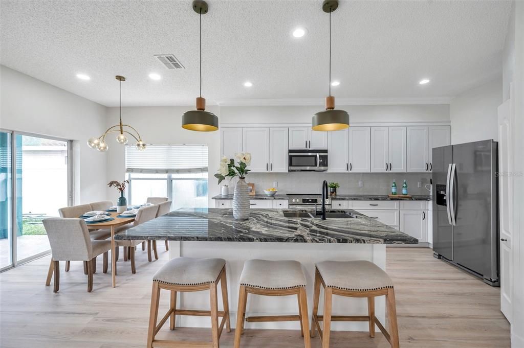 Dining room, Interior, Kitchen, Pendant Lights, Recessed Lighting, Stainless Steel Appliances, Wood Texture Flooring