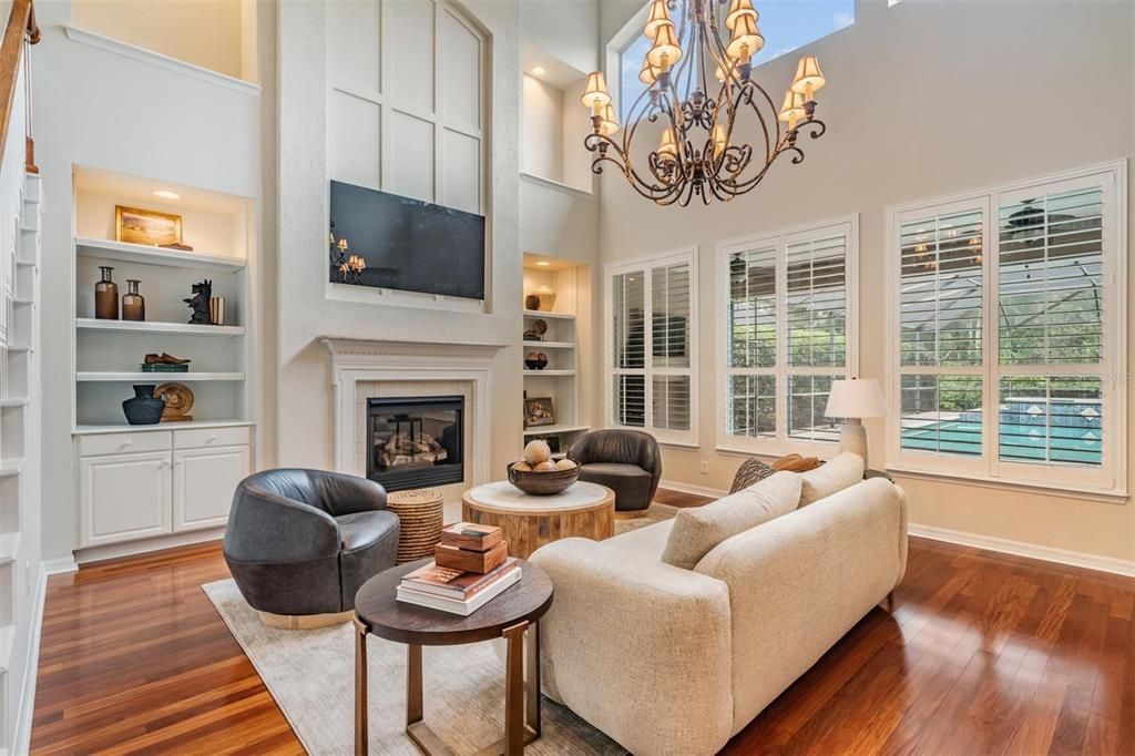 Chandelier, Fireplace, Interior, Living room, Recessed Lighting, Wood Texture Flooring