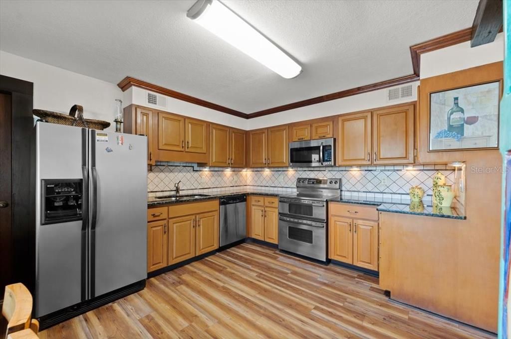 Interior, Kitchen, Stainless Steel Appliances, Tile Countertops, Wood Texture Flooring