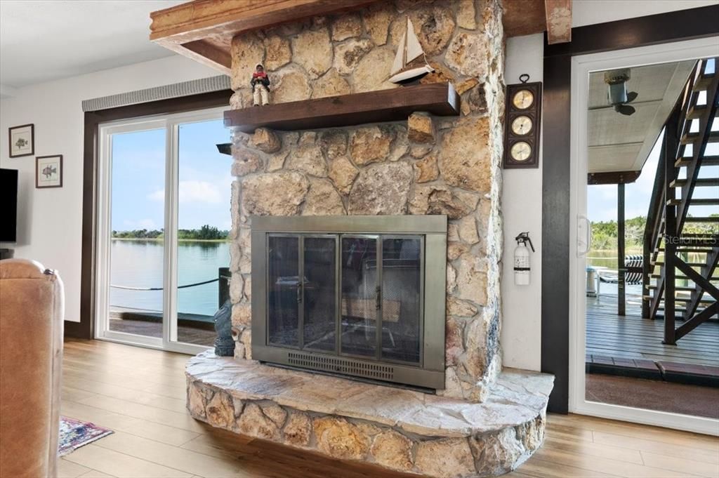 Fireplace, Interior, Stone Walls, Water, Wood Texture Flooring