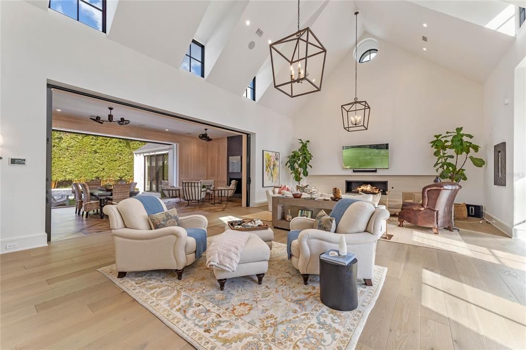 Dining room, Fireplace, Interior, Living room, Pendant Lights, Recessed Lighting, Wood Texture Flooring