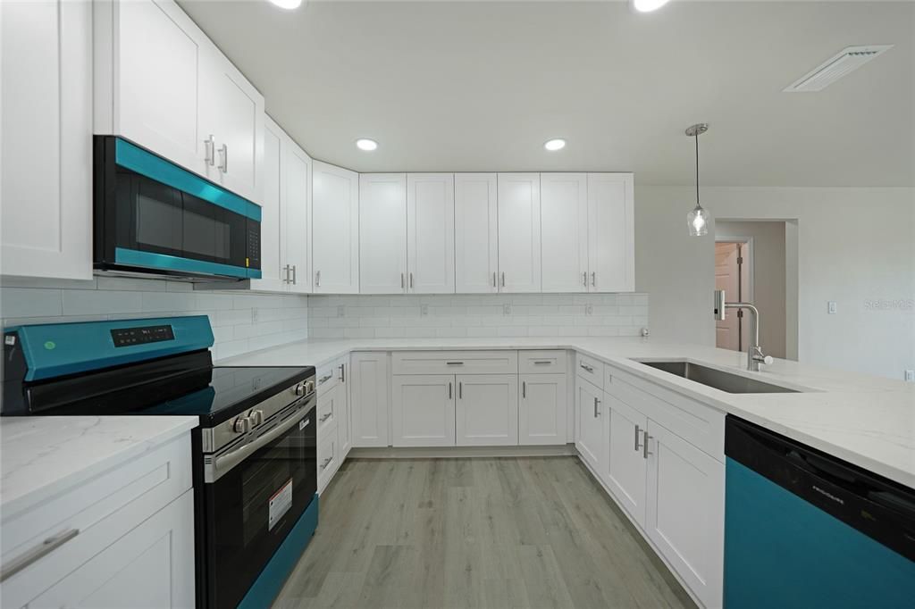 Interior, Kitchen, Pendant Lights, Recessed Lighting, Stainless Steel Appliances, Wood Texture Flooring