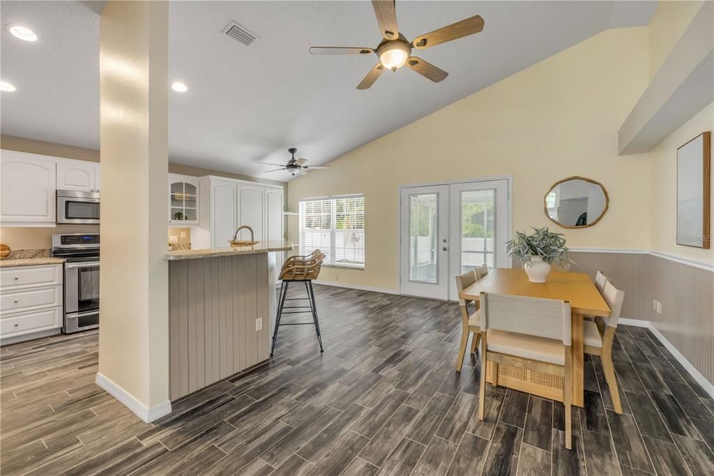 Dining room, Interior, Kitchen, Recessed Lighting, Stainless Steel Appliances, Wood Texture Flooring