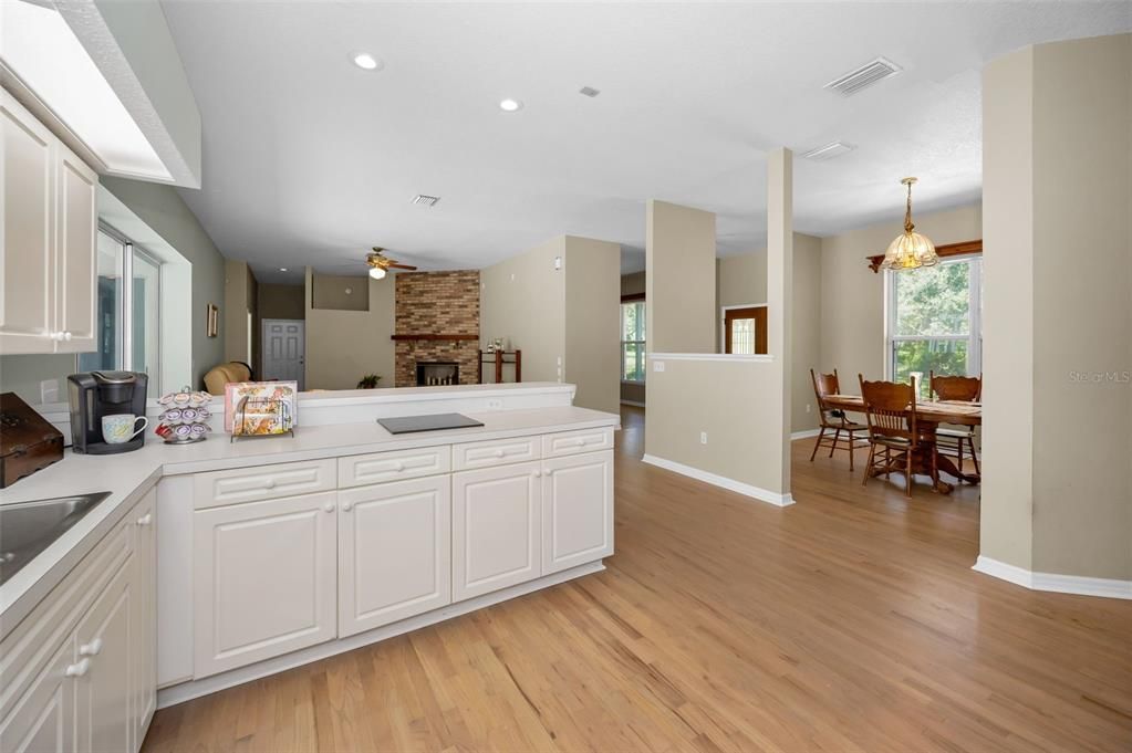 Dining room, Fireplace, Interior, Pendant Lights, Recessed Lighting, Stone Walls, Wood Texture Flooring
