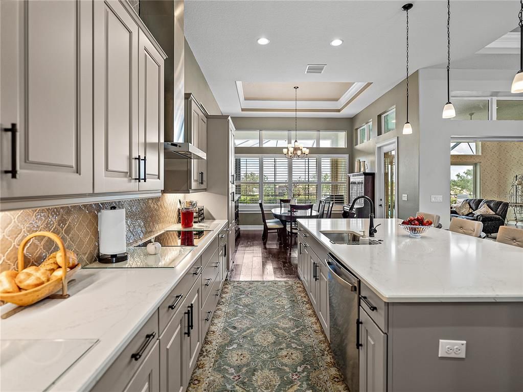 Chandelier, Dining room, Interior, Kitchen, Pendant Lights, Recessed Lighting, Stainless Steel Appliances, Wood Texture Flooring
